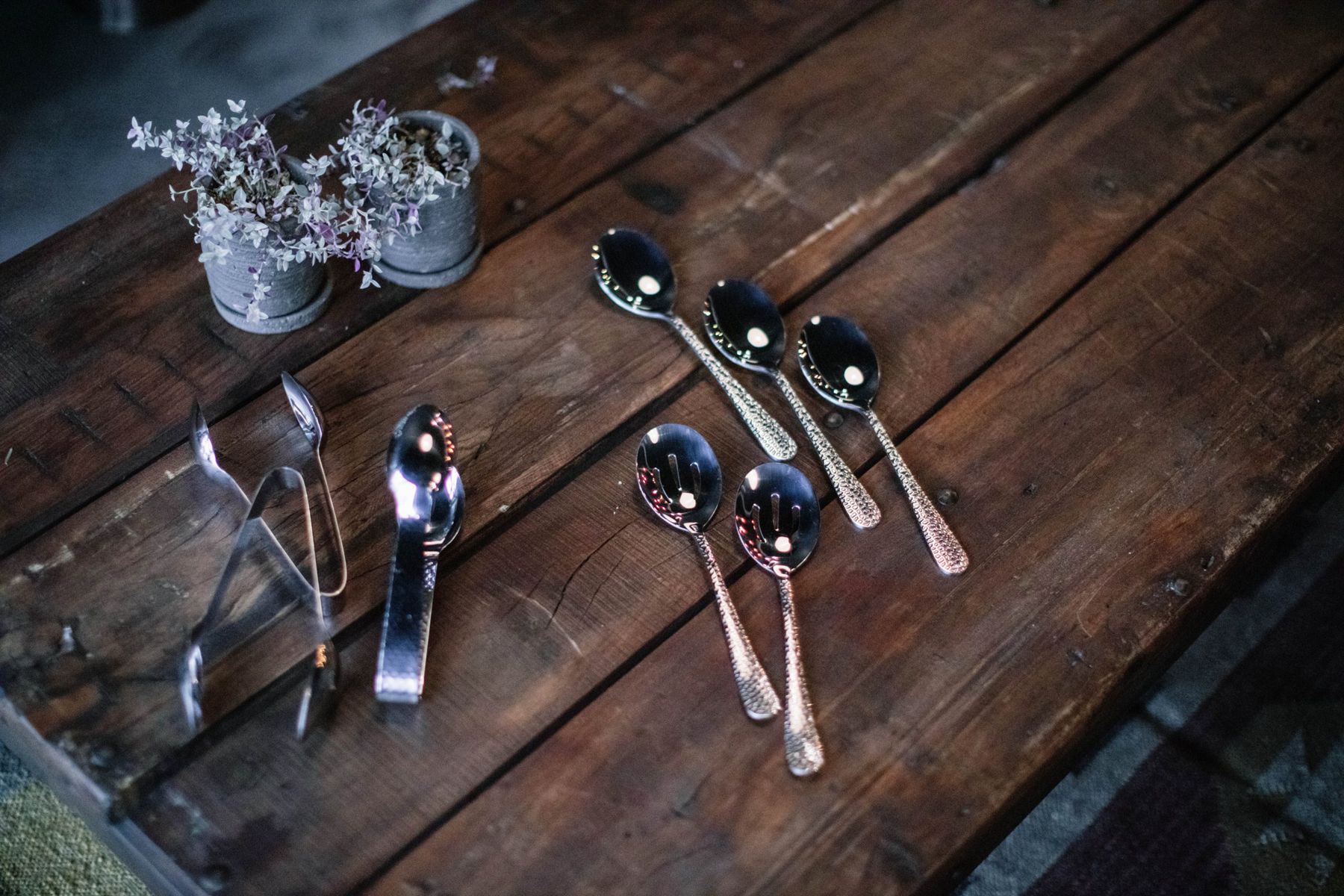 Silver flatware on a wooden table