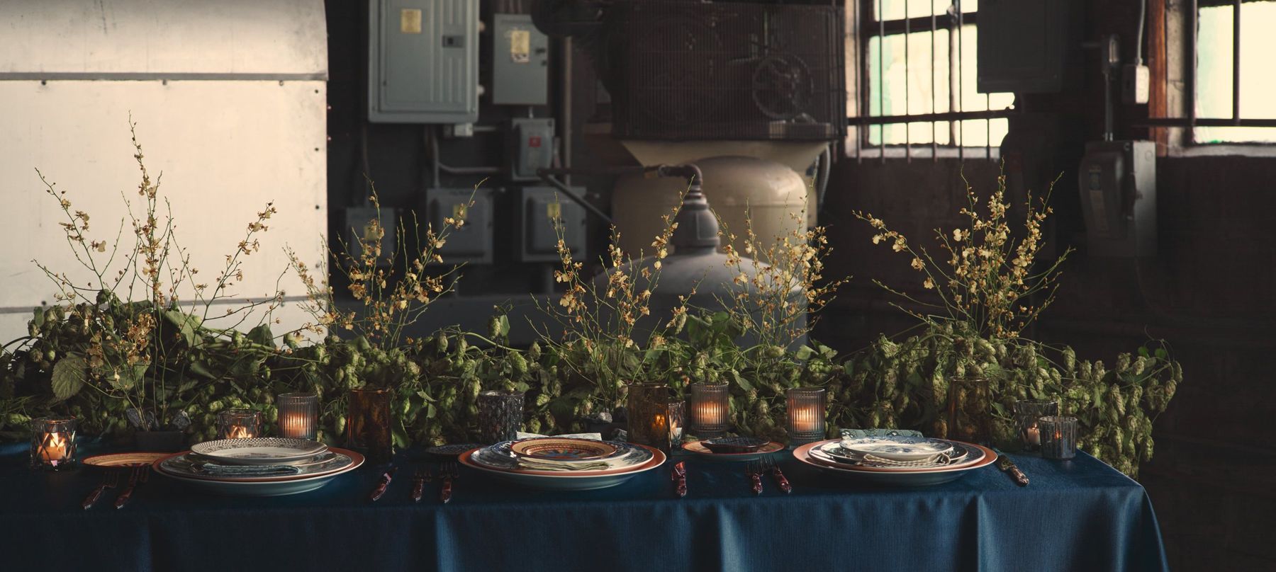 Flatware arranged against a weathered wooden wall